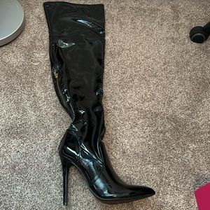 Black latex high knee boots